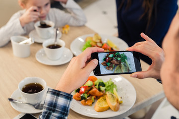 Close-up Man's hands Taking Picture Of Food With Mobile smart Phone