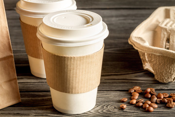 coffee cup to go at wooden background