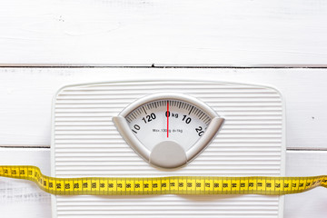 floor scale and centimeter to measure wooden background top view