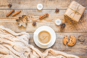 Christmas muffler with cup of cocoa wooden background top view