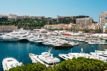 Fototapeta na wymiar Yachts moored at town quay In Monaco, Monte Carlo