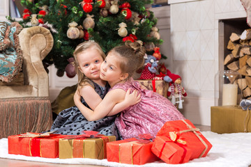 Two little girls with Christmas present