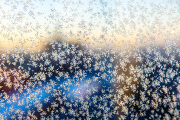Little frosty patterns on glass, visible snowflakes. Winter in R