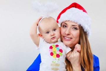Christmas woman with cute baby.