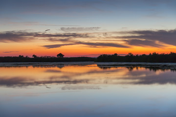 Fototapeta na wymiar Sunset over water - Merritt Island Wildlife Refuge, Florida