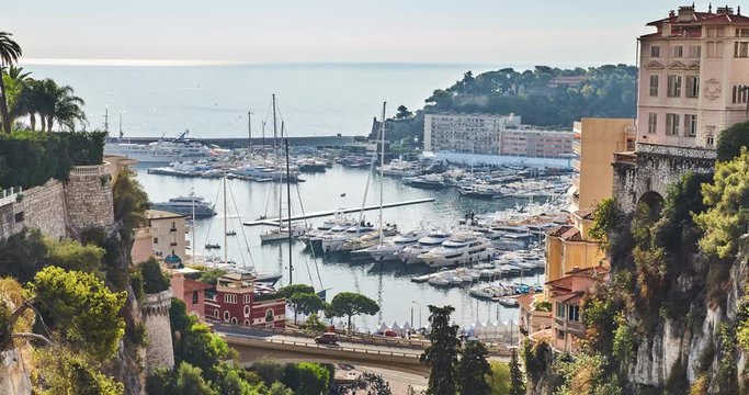 Timelapse of Preparation for a World Fair of the yacht show Monaco from railway station Monaco, is placed by megayachts, MYS, on the horizon yachts, the old city of Monaco