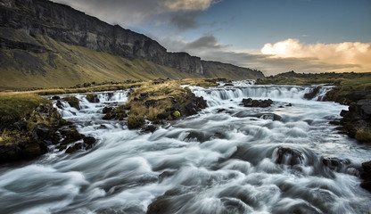 stunning river flow beside the road along iceland