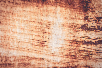 A background of peeling paint and rusty old metal