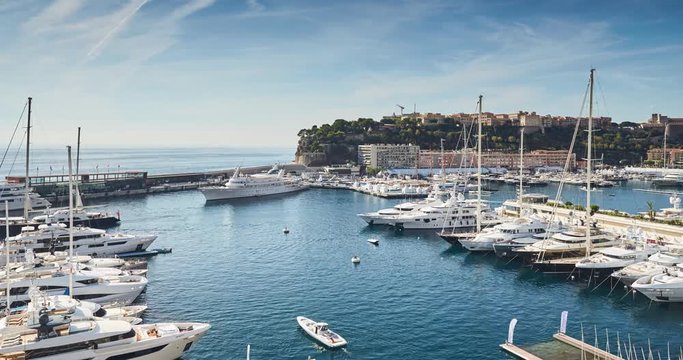 Timelapse of Preparation for a World Fair of the yacht show Monaco in port Hercules, is placed by megayachts, MYS, on the horizon yachts, the old city of Monaco