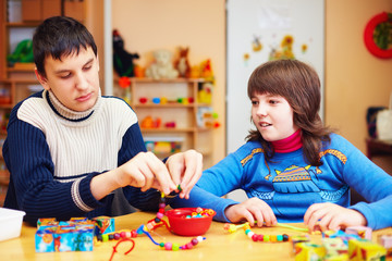 kids with special needs develop their fine motor skills in daycare rehabilitation center