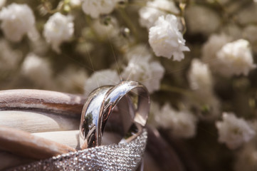 The composition of the bouquet and wedding rings closeup
