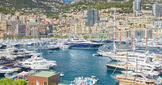 World Fair MYS Monaco Yacht Show, Port Hercules, luxury megayachts, many shuttles, taxi boat, presentations, Journalists, boat traffic, Azur water, aerial view, mountains on background, perspective