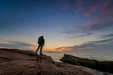 Backpacker Watching the Sunrise in Acadia National Park 