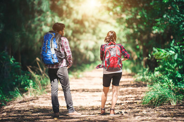 Rear of the couple hiking. Couple adventure travel.