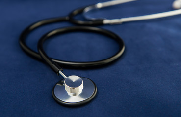 Stethoscope on dark blue background