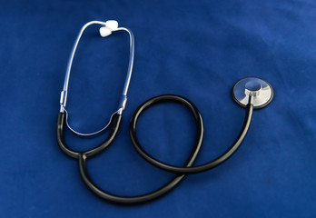 Stethoscope on dark blue background