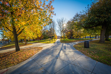 Walkway and autumn color at Franklin Square Park, in Baltimore,