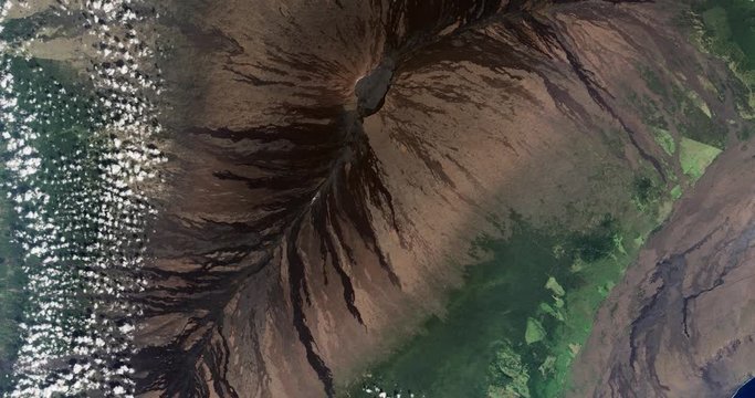 High-altitude overflight aerial of the Mauna Loa volcano, Hawaii. Clip loops and is reversible. Elements of this image furnished by USGS/NASA Landsat 