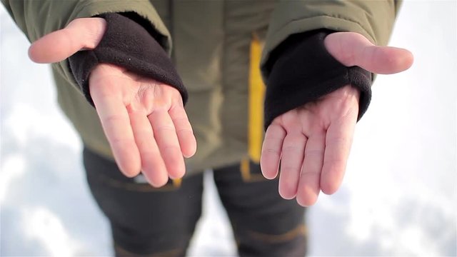 Warm sleeve cuffs with thumb hole. man's hands.