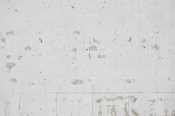 grunge white brick wall with paint peel off