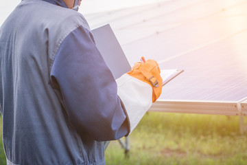 an engineer working on checking equipment in solar power plant