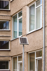Small solar panel near a block of flats