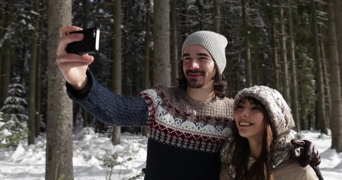 Couple Winter Snow Forest Walk Man And Woman Taking Selfie Photo Smart Phone Happy Smile Slow Motion 120