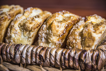 Upclose of sweet, fresh apple pi braided danish.