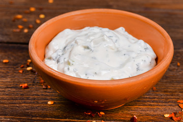 White sauce on a wooden table