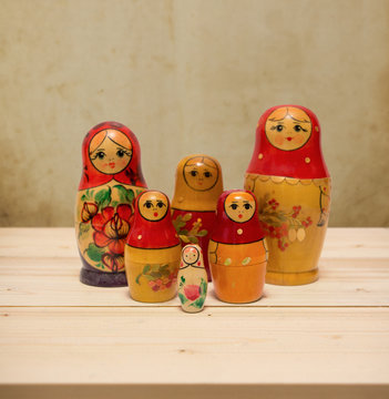 Matryoshka, national russian dolls on wooden table