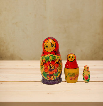 Matryoshka, national russian doll on wooden table