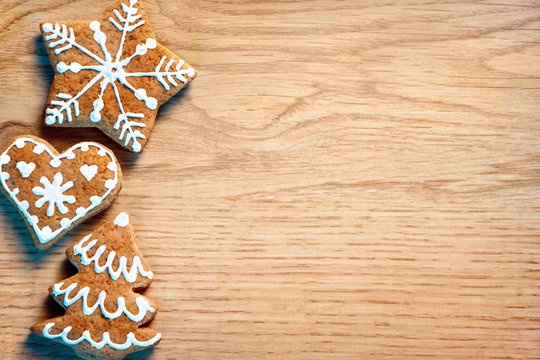 Merry Christmas and Happy new year! Christmas cookies on wooden background. Top view. Copy space for your text
