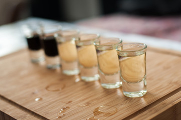 Brandy in shot glasses lined up in a row