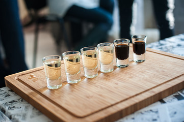 Brandy in shot glasses lined up in a row