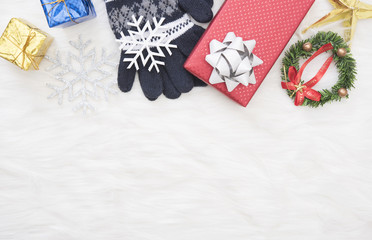 Christmas background with decorations gift box and snowflake on white table.
