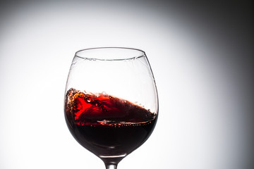 Stream of wine being pouring into a glass.