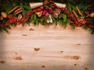 Christmas and new year background with gingerbread cookies, cones and spices.