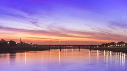 Fototapeta na wymiar Sunset Bridge over the river in Thailand.