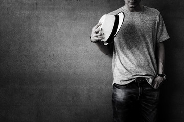 Men's casual outfits standing over grunge background with space, beauty and fashion concept, black...