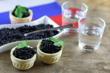 black caviar on a wooden background