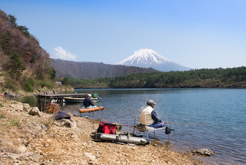 Mt Fuji behind with fishing men