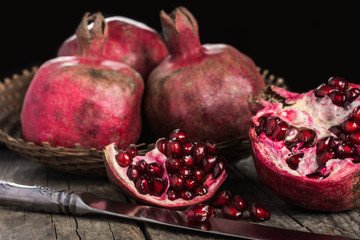 Pomegranates on wooden background