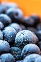 Frozen aronia chokeberry berries in a bowl