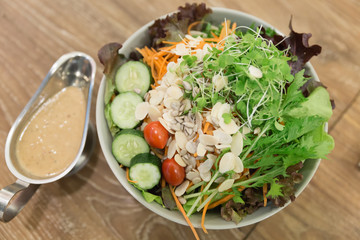 Fresh salad bowl with colorful tomatoes, cucumber, mixed greens