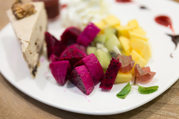 dragon fruit, grape, mango and kiwi with coffee cake