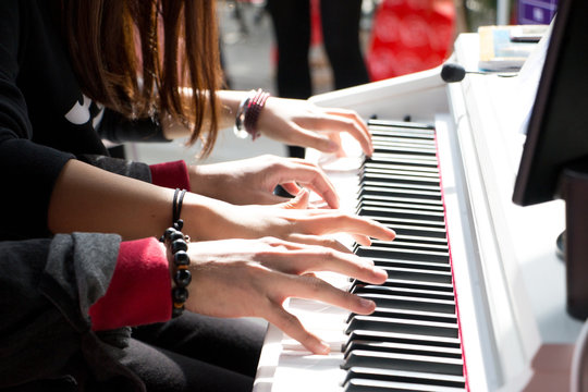 hand touch piano keys