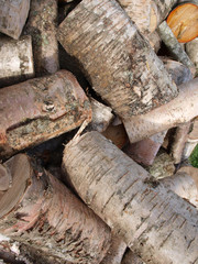 Pile of old birch firewood background