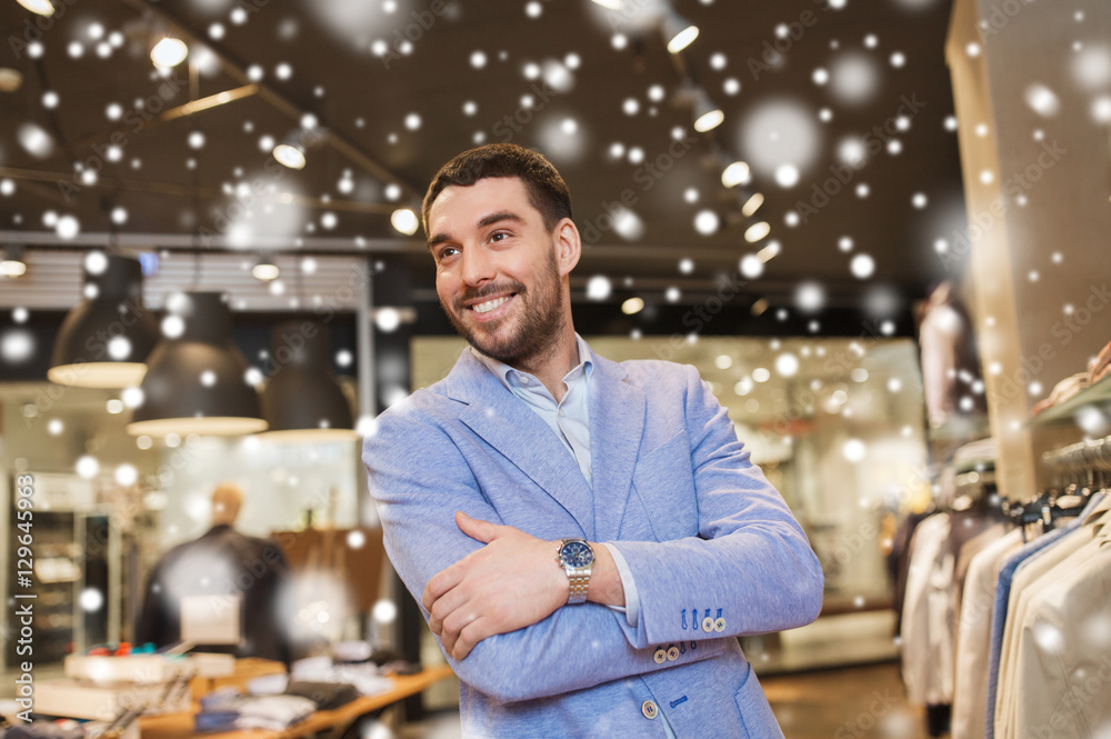 Wall mural happy young man in jacket at clothing store