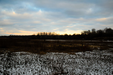 Beautiful sunset on a meadow on winter