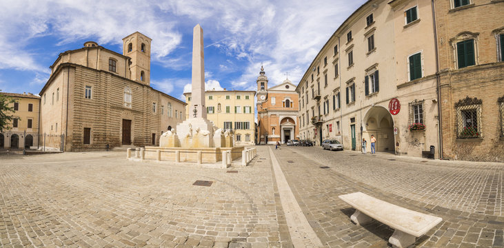 Historical buildings and obelisk of the ancient Piazza Federico II, Jesi, Province of Ancona, Marche
